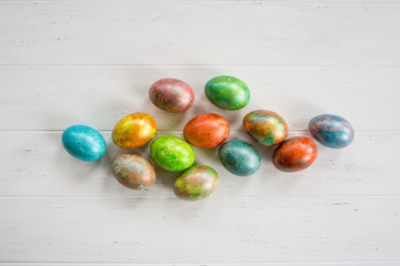 Easter eggs on white wooden background