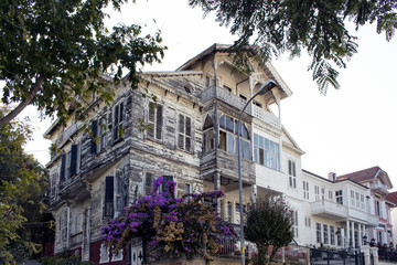 Fototapeta na wymiar View of old, historical, wooden mansion in Heybeliada which is one of Prince islands near Istanbul.