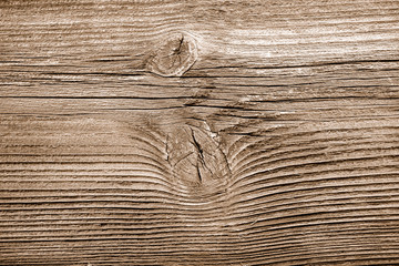 altes braunes Holzbrett mit Maserung und Astloch und Textur als Hintergrund 