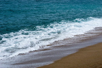 Fototapeta na wymiar Sea on a sandy beach in europe