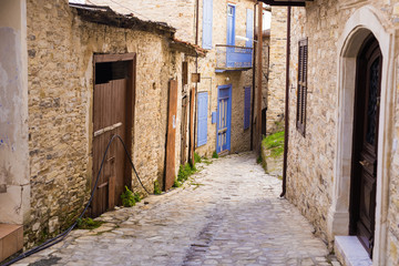 Fototapeta na wymiar Beautiful view of scenic narrow alley with historic traditional houses in an old town in Europe