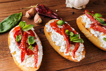 Italian sandwiches - bruschetta with cheese, tomato and basil