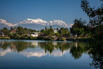 View at Annapurna mountain range and its reflection in Phewa lake in Pokhara, Nepal