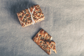 Cookies with seeds tied with a ribbon on light background. Toned