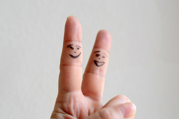Gesture of victory with your fingers. Funny abstract scene of the hand. A comic figure on the human...
