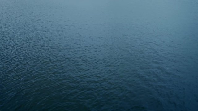 Clean, flat surface of the water in the lake
