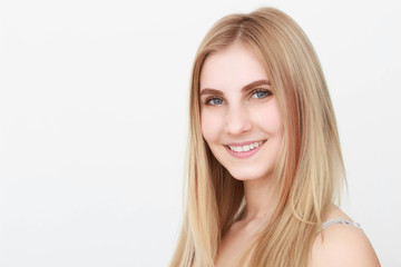 Naklejka premium Closeup portrait of a beautiful young blond woman with clean face