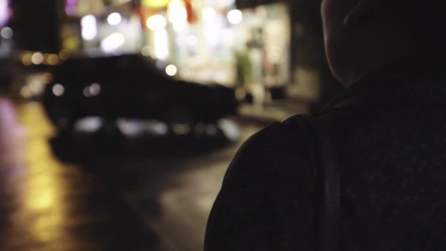 Woman Walking Alone In Urban Night