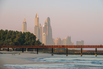 Fototapeta premium Dubai. In the summer of 2016. A water oasis in the early morning of the Madinat Jumeirah on the Arabian Gulf. The view from the shore of the Dubai city.