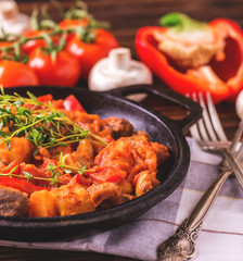 Traditional goulash soup close-up on  wooden table. Ingredients.