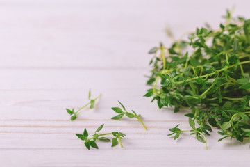 Bunch of fresh organic thyme on wooden background