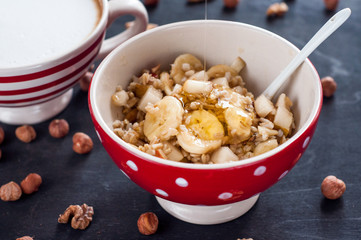 Healthy breakfast, oatmeal, banana, pear, honey, flax seeds, chia seeds