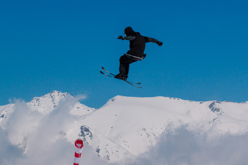 Naklejka na ściany i meble 2017 04 Sochi, Russia, Festival NewStarCamp: skier jumps from a high springboard