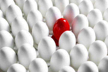 White egg and one red, made from plaster