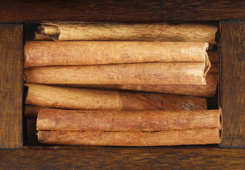 cinnamon (cassia) in wooden box isolated