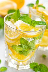 Lemon mojito cocktail with fresh mint, cold refreshing summer drink or beverage with ice