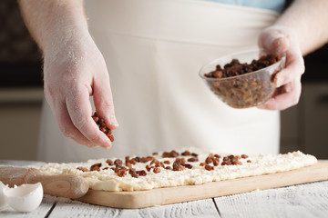 Making Sweet yeast bread with raisins, selective focus