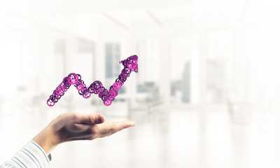 Progressing graph presented in male palms as symbol of success a