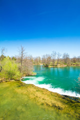Fototapeta na wymiar Beautiful landscape, waterfall, clear green water and on Mreznica river in Croatia. Beautiful world. Panoramic view. 