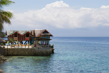 Sunset on the beach. With a view of the islands. Orange, yellow colors.