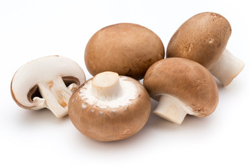 Fresh champignon mushrooms isolated on white.