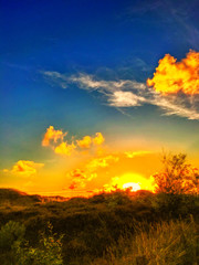 Obraz na płótnie Canvas Dunes, grass, sunset, sky