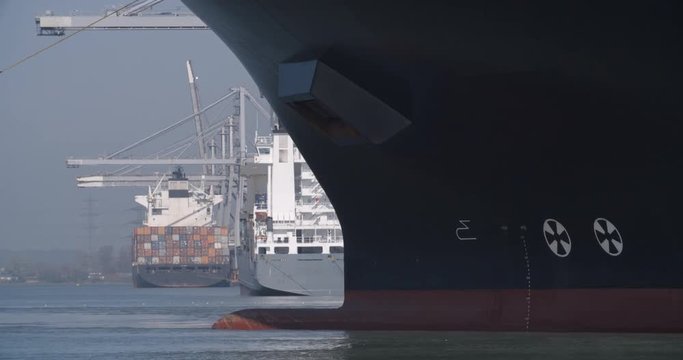Container ship at Southampton Docks - 06 - A large container ship sails through docks in the UK port of Southampton. Shot in 4K on an FS7 camera. 