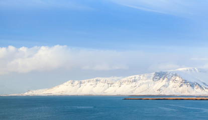 Coastal Iceland landscape, snow mountains