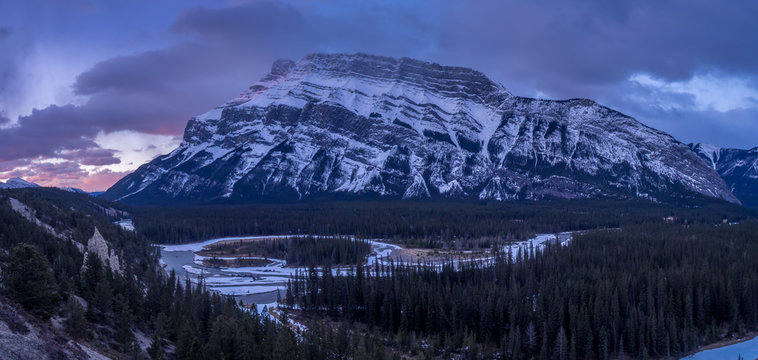 The Bow River meandering below the Rundle Mountain in Banff National Park at sunrise.