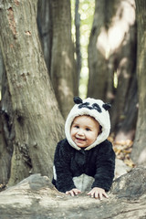 Cute baby boy wearing a Panda bear suit
