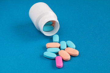 Cure for all diseases on a blue background. A bottle of pills