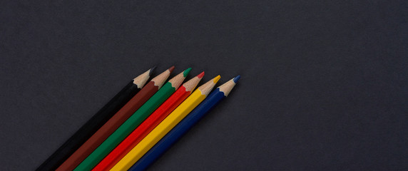 Color pencils isolated on black background.Close up.