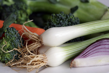 Obraz na płótnie Canvas Scallions, red onion, brocculi and carrot; fresh vegetables background.