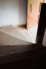 Light coming through doorway on stairwell of Old Red Fort in old Delhi, India