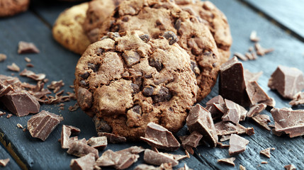 Chocolate cookies on wooden table. Chocolate chip cookies shot