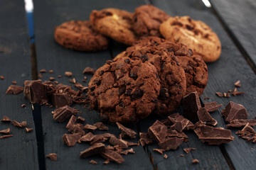 Chocolate cookies on wooden table. Chocolate chip cookies shot