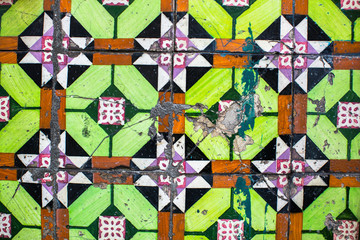 Fototapeta premium Portuguese traditional tiles Azulejo with pattern at facades in old downtown Porto, Portugal.
