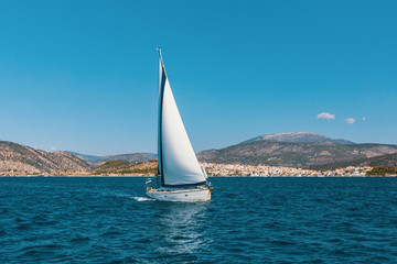 Fototapeta na wymiar Sail yachts in the Sea. Luxury boats.