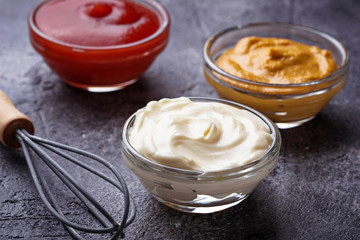 Obraz na płótnie Canvas Set of different sauces: mustard, ketchup, mayonnaise.