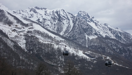 Snowy mountains and cable cars in Sochi, Russia.