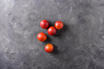 Sicilian oranges on the gray abstract background. Sicilian orange. Citrus fruits. Mixed festive colorful tropical and citrus fruit. Healthy eating photo concept. Copyspace