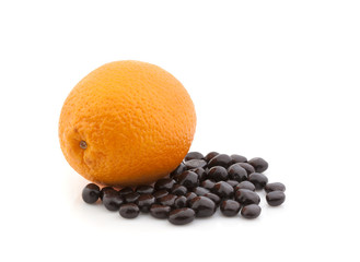 Orange with chocolate dragee on white background. Isolated.