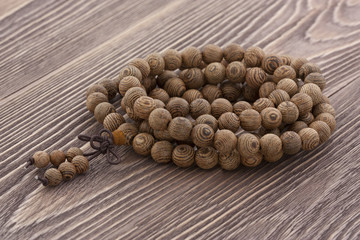 Rosary on a wooden background