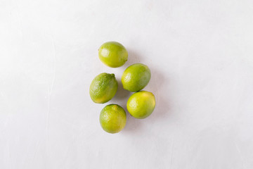 Lime on a light background. lemons Sicilian orange. Citrus fruits. Mixed festive colorful tropical and citrus fruit. Healthy eating photo concept. Copyspace