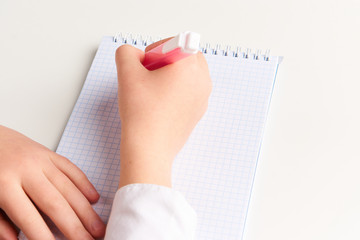 markers in hand notebook on the table