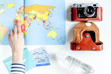 tourist stuff with camera and map on white background top view