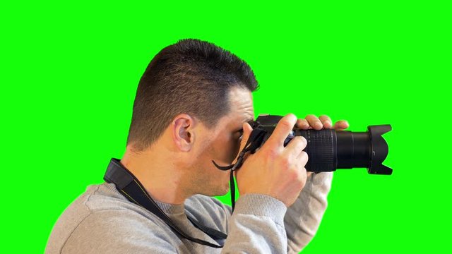 Greenscreen Photographer Close Up Side View Zooming and Focusing to Snap Photo