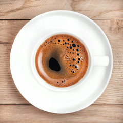 Coffee cup on rustic wooden table. 