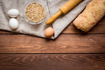 Dried crumbs with bread on kitchen table background top view mokeup