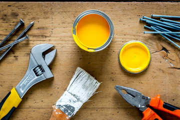 instruments set for decorating and building renovation on wooden background top view